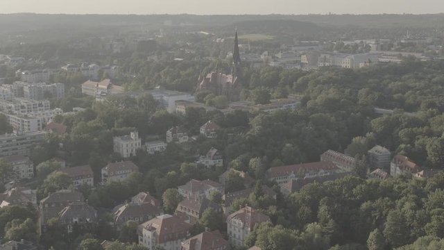 Aerial of Dresden Neustadt with view to the Martin Luther Church, Drone view over the baroque city, green trees, log, 4K 