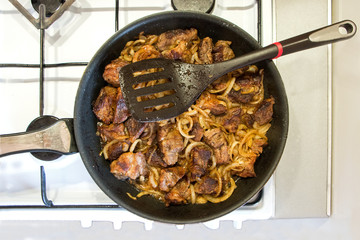 Fried meat with onions.