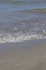 Sand on beach by ocean