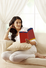 Portrait of a woman reading a book