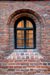 Fototapeta na wymiar Window at the Brick Wall