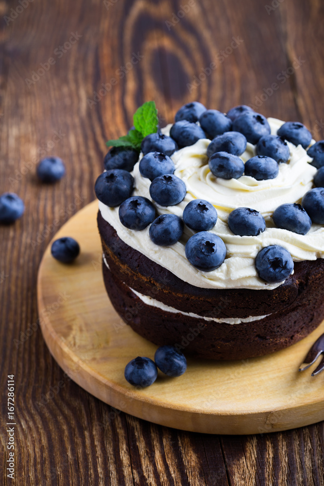 Wall mural Berries chocolate layer cake with blueberries