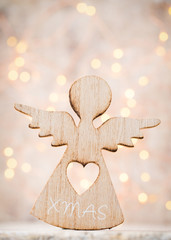 Christmas decor with angel santa hat. Vintages background.