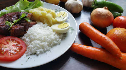 Lunch with fresh vegetables on wooden table
