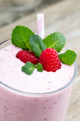 Raspberry milk shake with mint decor.