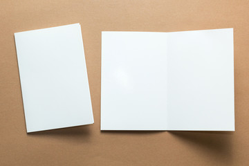 Business card, brochure magazine isolated on brown background, white paper. mockup