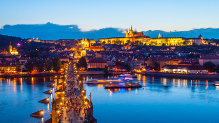 Prague evening panorama. Aerial view of Prague Castle and Charles Bridge over Vltava river from Old Town Bridge Tower, Czech Republic.