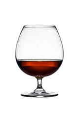 Glass with cognac on white background isolated. Front view. Close up shot. High resolution