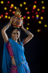 Gujarati woman holding a kalash 