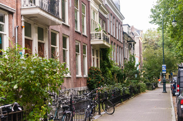 Fototapeta na wymiar Bicycles parked up in a pretty street in Utrecht, Netherlands