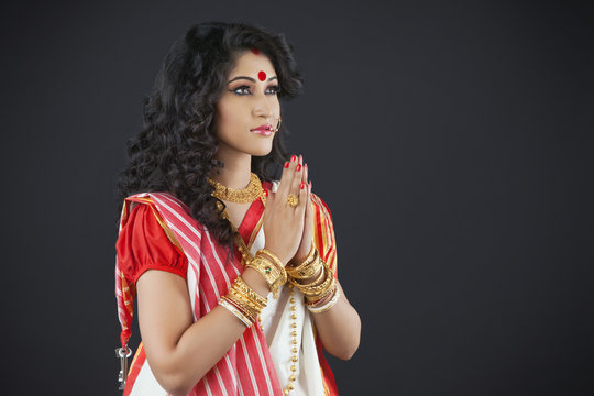 Bengali woman praying Stock Photo | Adobe Stock