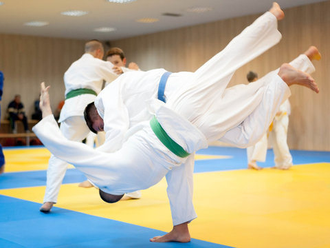 Young judoka throwing his opponent