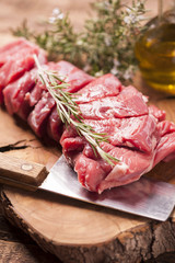 fresh raw meat on old wooden table