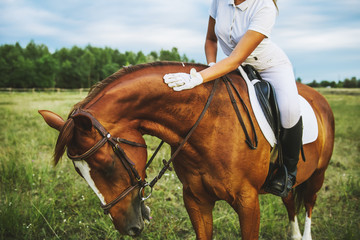 Girl jockey riding a horse