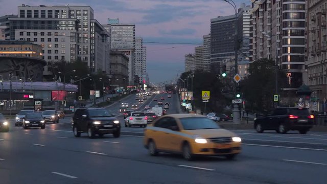 Cityscape at dusk with the cars traffic on a New Arbat Avenue - large city street