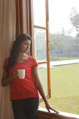 Woman looking out of window