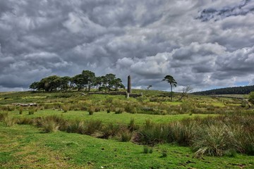 Old Tin Mine, old ruined granite buildings set on Dartmoor.. Dartmoor National Park is vast moorland in the county of Devon, England UK.