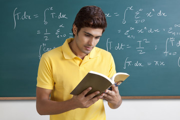 College student reading a book