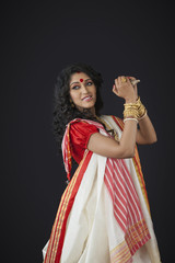 Bengali woman holding a conch shell 