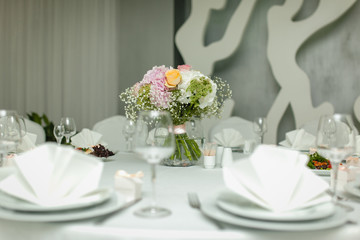 The bride's bouquet at the wedding table.