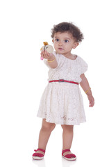 Full length of cute girl holding toy against white background