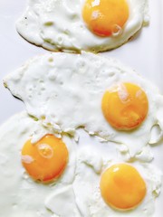 Fresh organic fried eggs, sunny side up 
