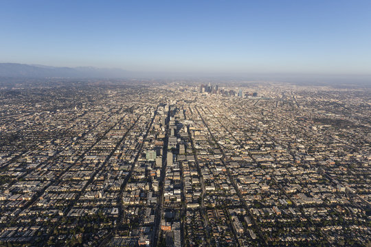 Smoggy summer afternoon aerial view of the Wilshire District and downtown Los Angeles in Southern California.  
