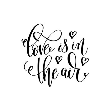 love is in the air black and white hand lettering inscription