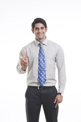 Portrait of a male executive gesturing