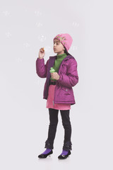 Girl blowing bubbles