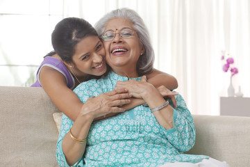 Granddaughter hugging her grandmother