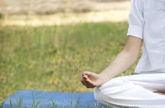 Cropped image of woman practicing yoga 