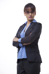 Portrait of confident business woman with arms crossed over white background 