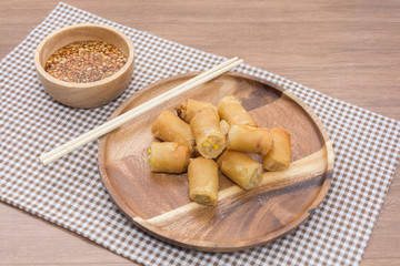 Fried Spring Roll on wooden plate with sauce