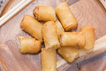 Fried Spring Roll on wooden plate with sauce