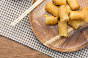 Fried Spring Roll on wooden plate with sauce