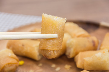 Fried Spring Roll on wooden plate with sauce