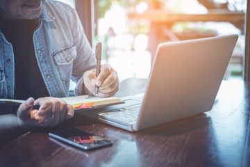 Fototapeta premium businessman review ideas and planning project to investment at coffee cafe 