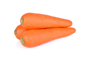 whole fresh carrot on white background