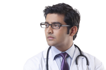 Fototapeta premium Close-up of handsome doctor over white background 