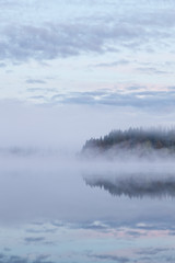 Obraz na płótnie Canvas Calm foggy lake scape summer night