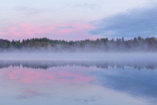 Calm foggy lake scape summer night
