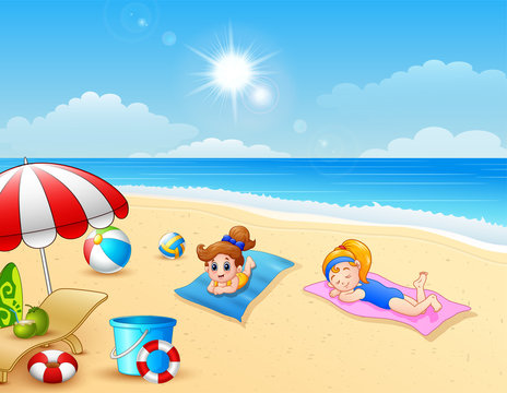 Two girl sunbathing on the beach mat