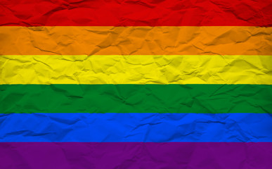 Gay Flag on crumbled Paper Sheet