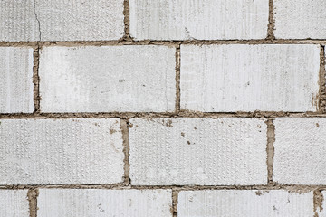 Big white bricks abstract texture, selective focus