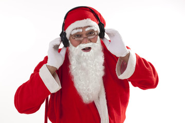 Portrait of Santa Claus listening to music over white background 