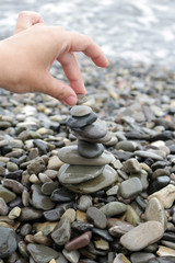 Fototapeta na wymiar Zen stones balance stack on a seashore