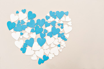 Wooden hearts, blue and beige color. forming a heart, with a retro effect