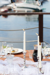 Glasses on the festive table setting. Wedding table decor concept. Table setting in classic style, setout. fine art.