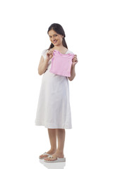 Pregnant woman holding a baby t-shirt